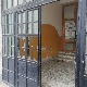 Поломљена стакла на улазним вратима школе у Обилићу